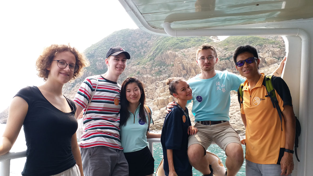 HKBU students pose together on a boat